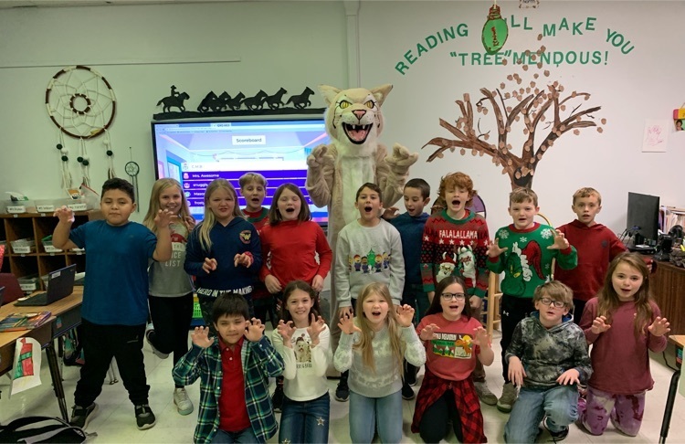3rd grade poses with new Mascot