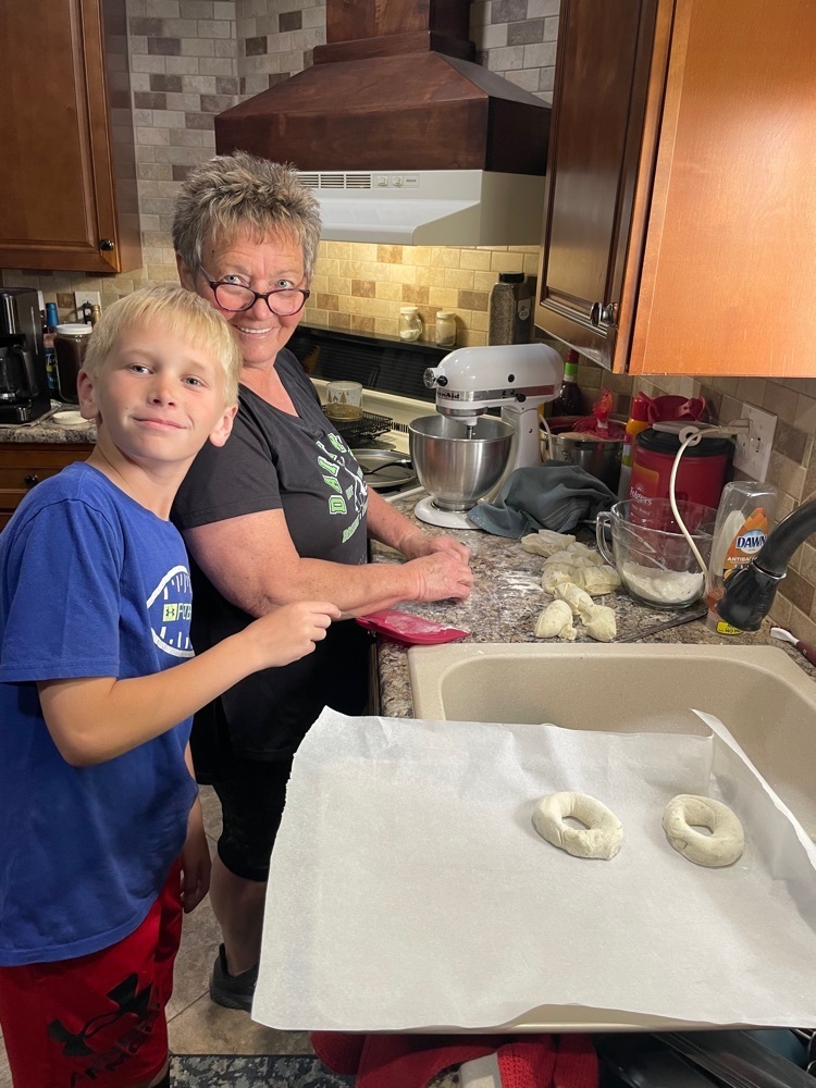 Carson and his grandma making the bagels.