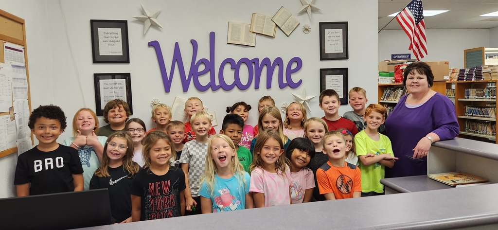 Mrs. Bathon's 2nd grade help welcome all to the newly revamped Breese library.  The stayed for a story and browsed for the perfect book to check out!